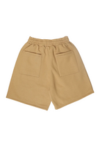 Beige shorts with a drawstring waist on a white background